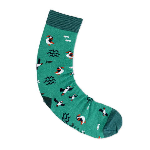 An image of Green Puffin, calf-length sock by Doris & Dude